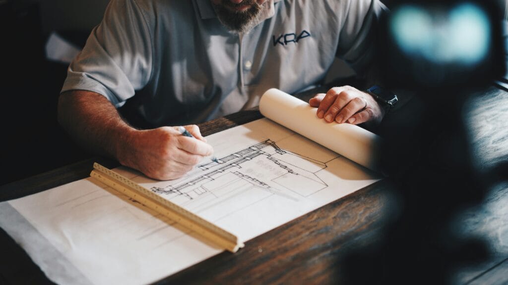 Home inspector on a roof performing an inspection